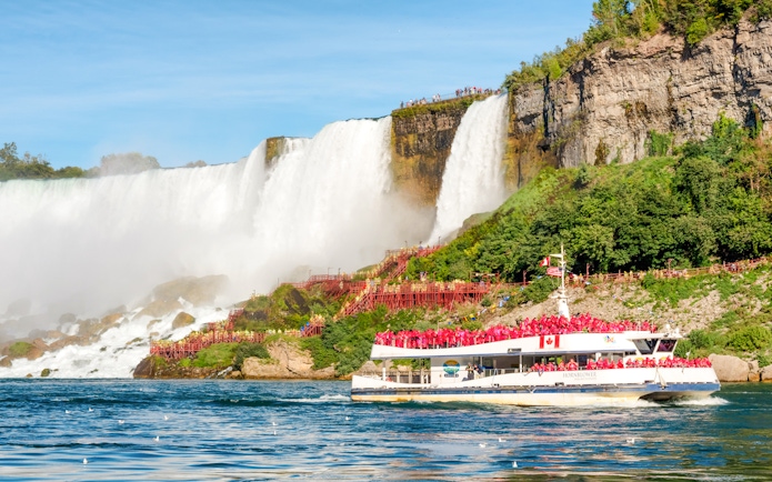 Tourists on Hornblower boat near Horseshoe Falls, Niagara Falls, Canada.