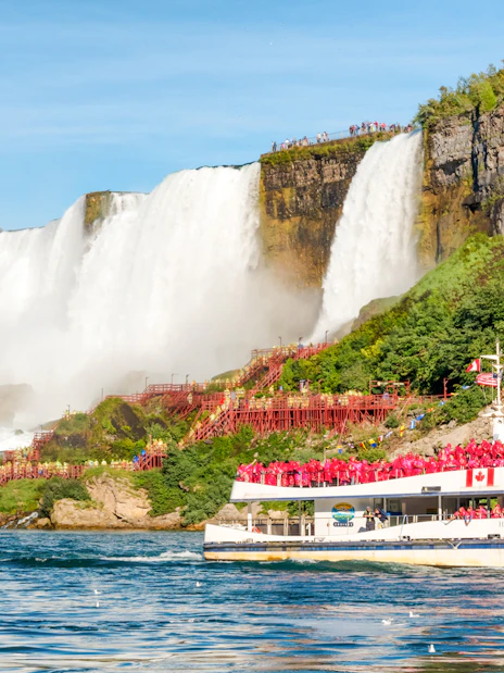 Tourists on Hornblower boat near Horseshoe Falls, Niagara Falls, Canada.