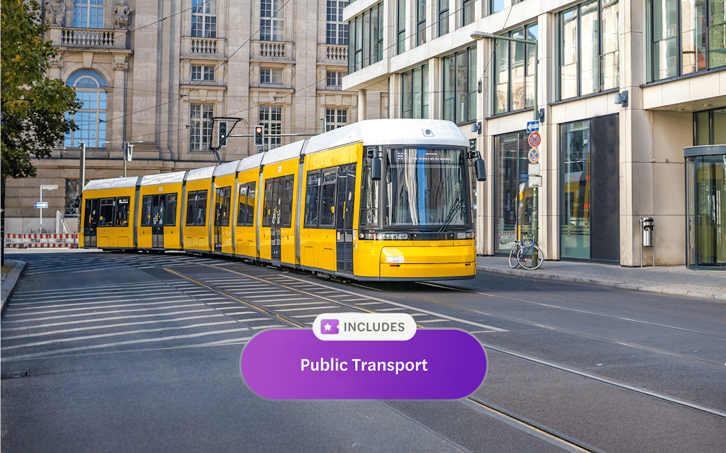 Yellow tram on Berlin street, part of Berlin WelcomeCard public transport offer.