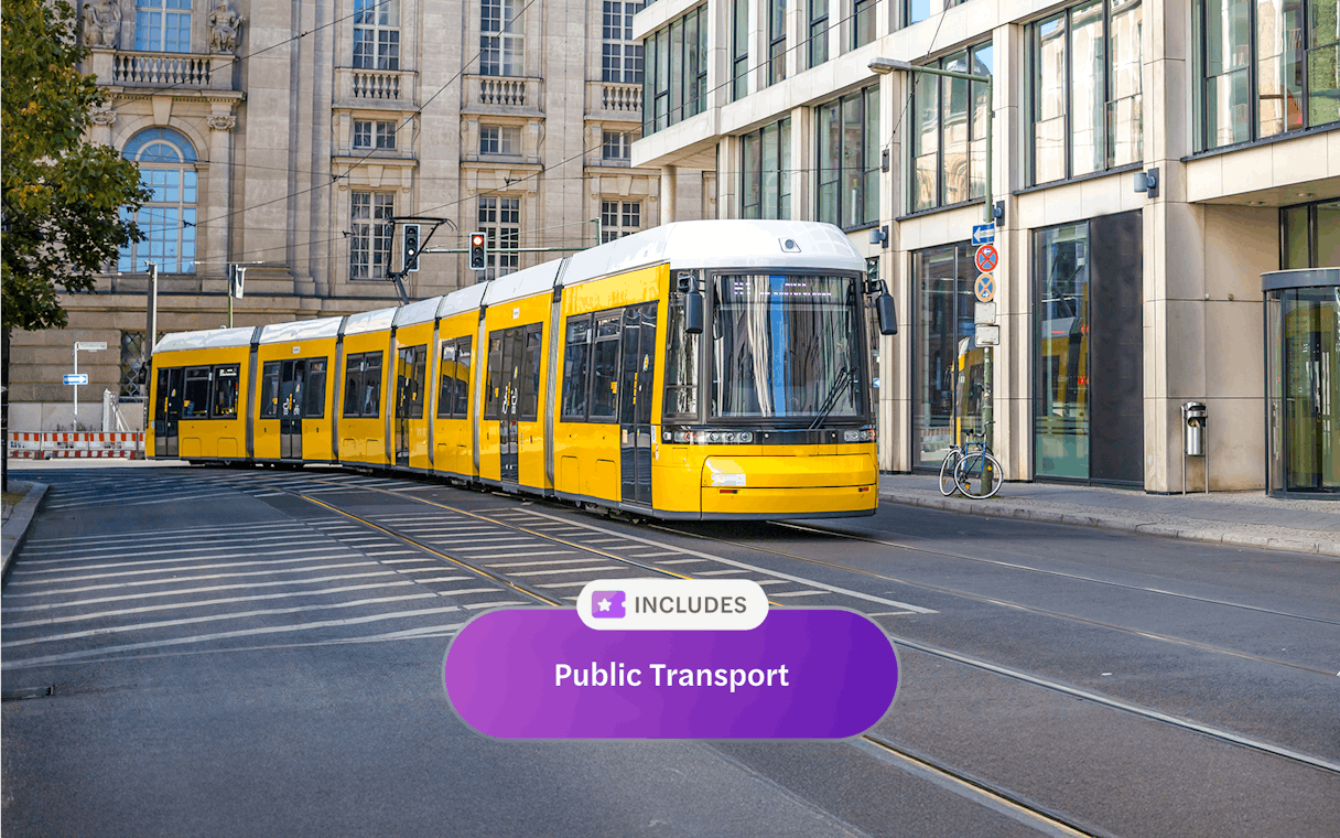 Yellow tram on Berlin street, part of Berlin WelcomeCard public transport offer.