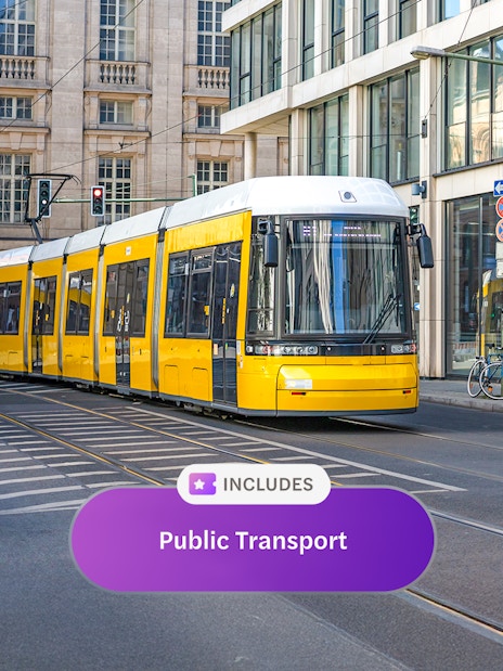 Yellow tram on Berlin street, part of Berlin WelcomeCard public transport offer.