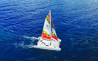 Sailboat on Kona waters during whale watching tour.