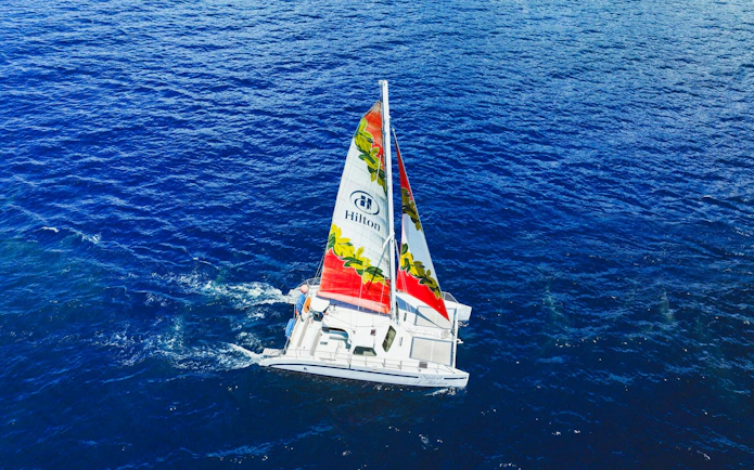 Sailboat on Kona waters during whale watching tour.