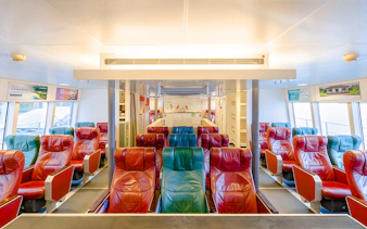 Ferry interior with colorful seats on the Singapore to Bintan Resorts route.