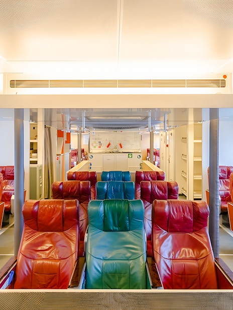 Ferry interior with colorful seats on the Singapore to Bintan Resorts route.