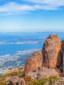 Kunanyi / Mt Wellington rocky summit overlooking Hobart and the Derwent River.