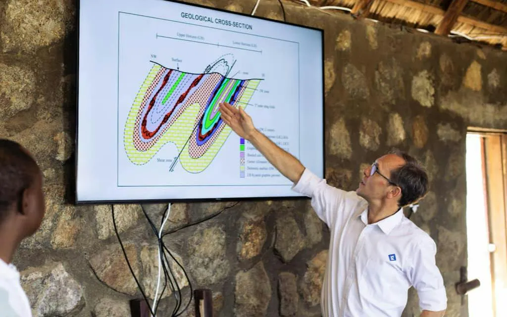 Geologist explaining a cross-section diagram at Mererani Tanzanite Mine, Tanzania.
