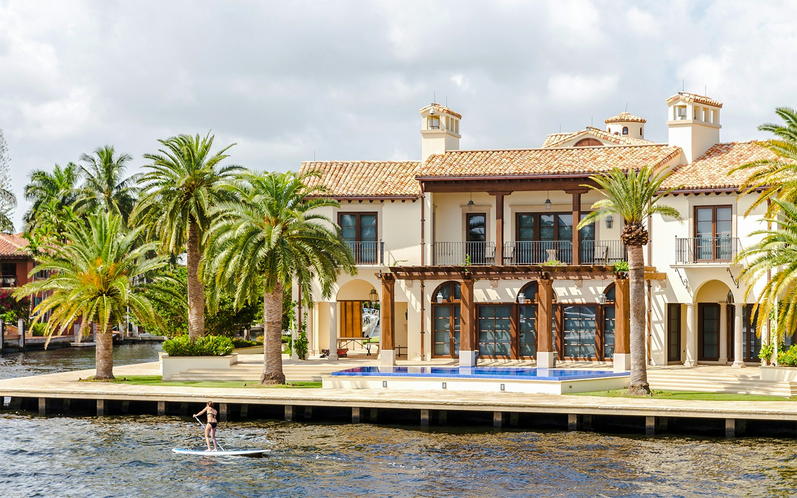 Luxury mansion with palm trees in Fort Lauderdale, Florida.
