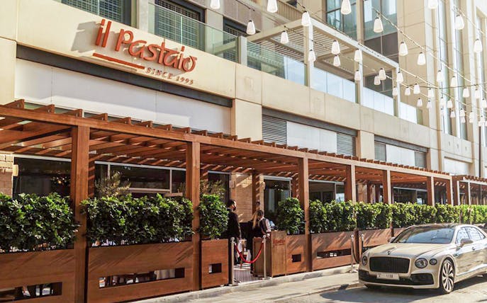 Il Pastaio Restaurant entrance with outdoor seating in Dubai.