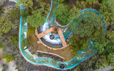 Aerial view of water ride surrounded by trees at Terra Mitica Benidorm.