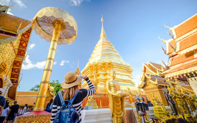 Girl admiring Wat Phra That Doi Suthep temple in Chiang Mai, Thailand.
