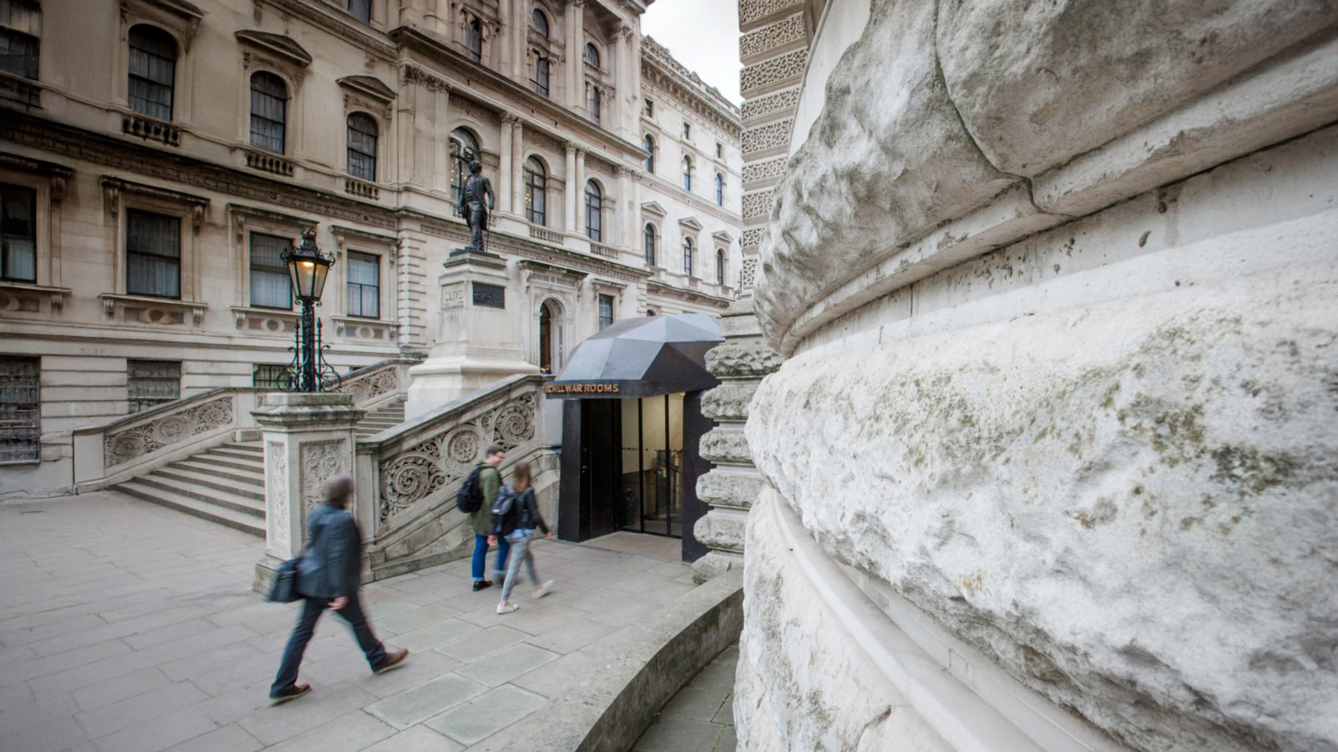 Guests walking near the entrance of Churchill War Rooms in London.