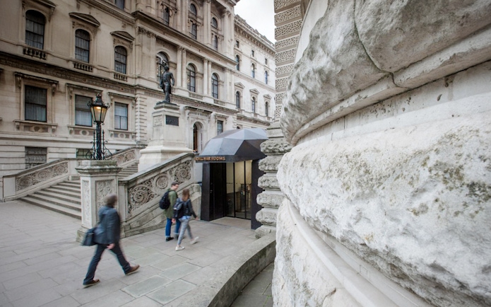 Guests walking near the entrance of Churchill War Rooms in London.
