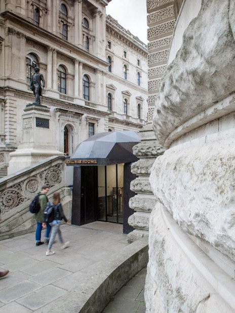 Guests walking near the entrance of Churchill War Rooms in London.