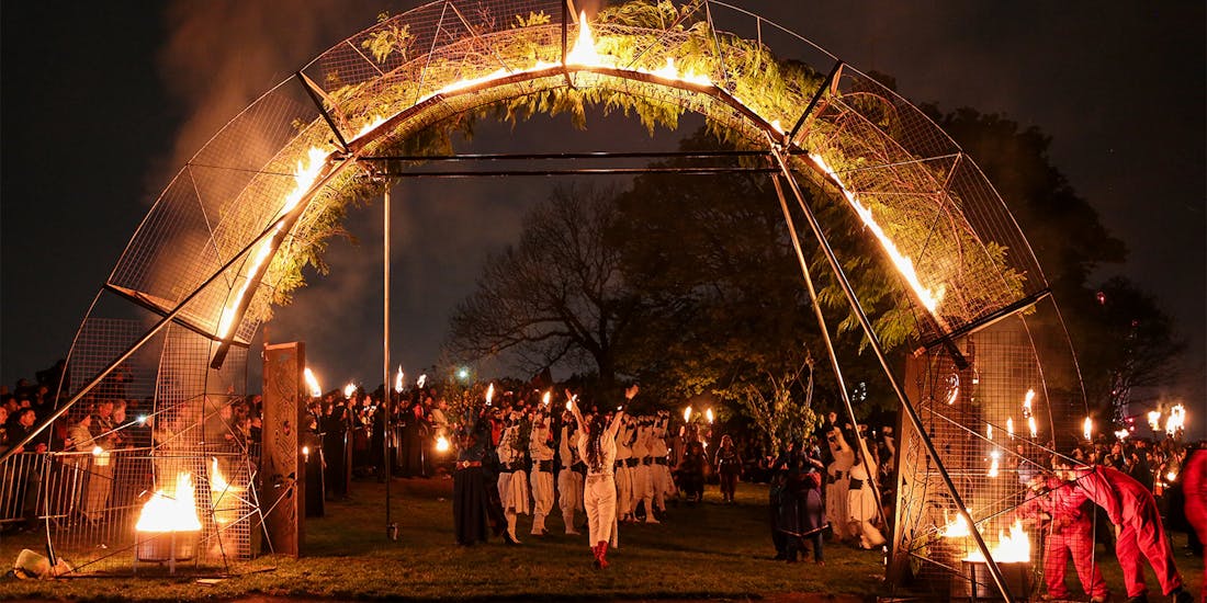 Woman in traditional attire splashing water during Songkran festival,Thailand