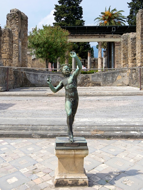 Bronze statue in the atrium of the House of the Faun, Pompeii Ruins.