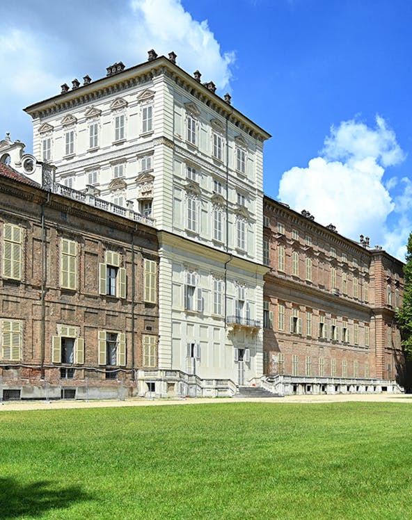 Musei Reali facade in Turin, Italy, with expansive green lawn.