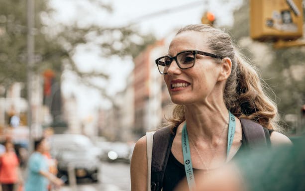 Tour guide leading a walking tour near SUMMIT One Vanderbilt in New York City.