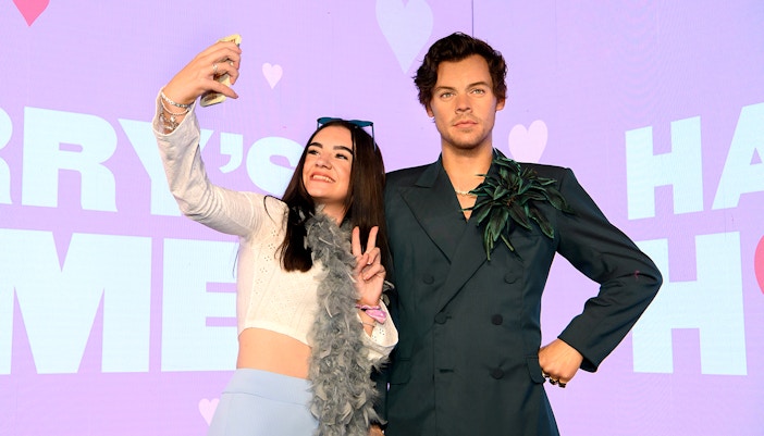 Person taking selfie with wax figure at Madame Tussauds, part of Harry Potter™ Warner Bros. Studio Tour combo.