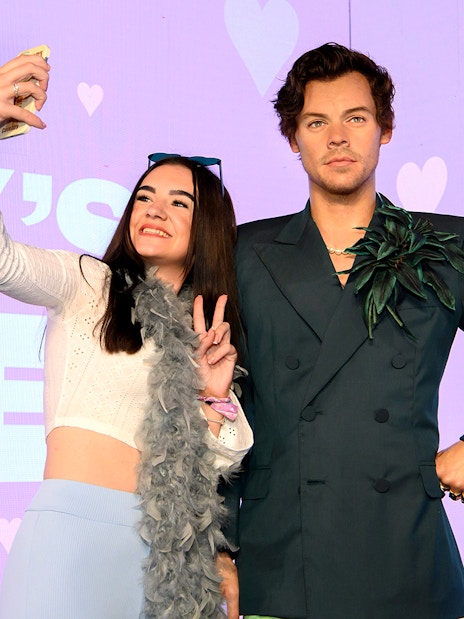 Person taking selfie with wax figure at Madame Tussauds, part of Harry Potter™ Warner Bros. Studio Tour combo.