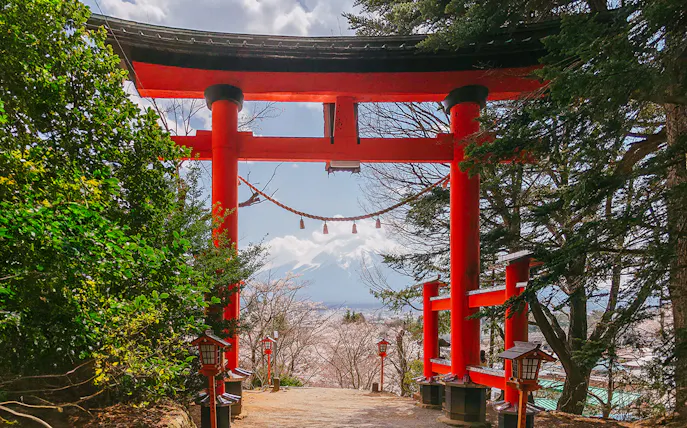 Torii gate at Arakurayama Sengen Park with Mount Fuji view.
