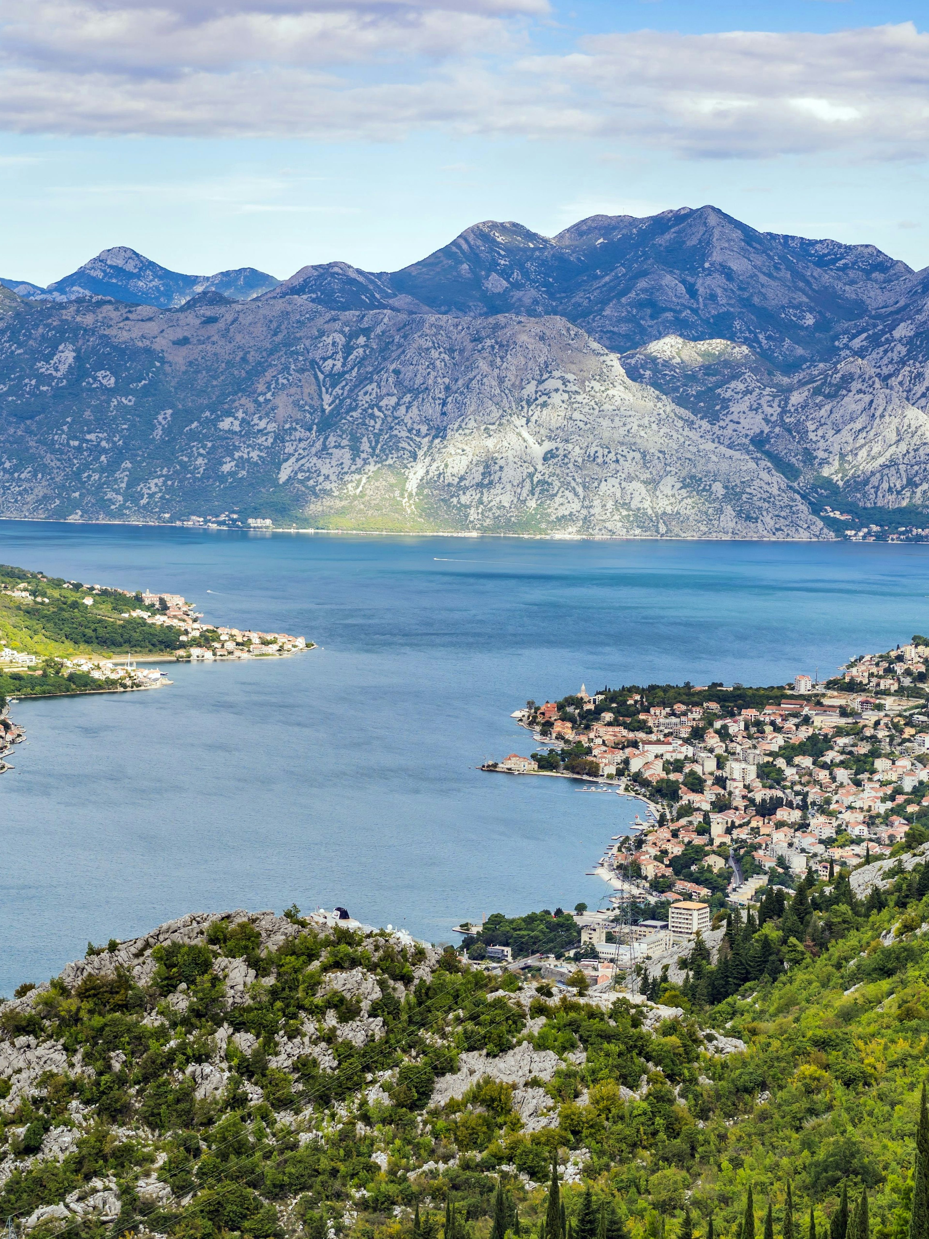 Bay of Kotor in Montenegro with coastal towns and surrounding mountains.