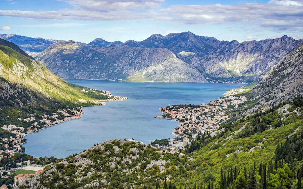 Bay of Kotor in Montenegro with coastal towns and surrounding mountains.