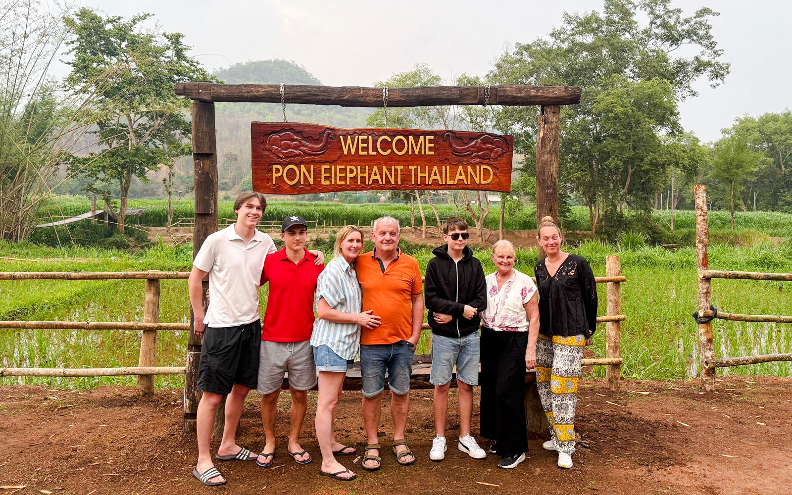 Group at entrance of Pon Elephant Thailand, Chiang Mai sanctuary.