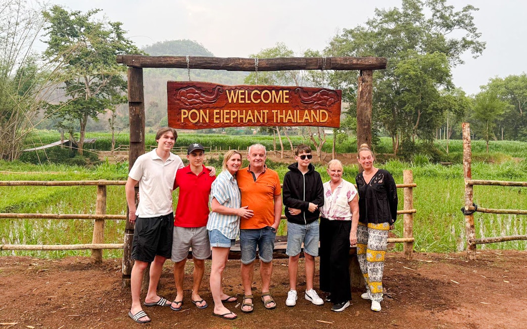 Group at entrance of Pon Elephant Thailand, Chiang Mai sanctuary.
