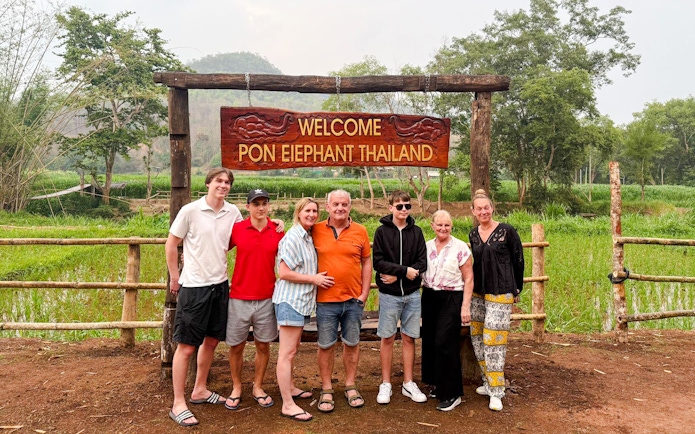 Group at entrance of Pon Elephant Thailand, Chiang Mai sanctuary.