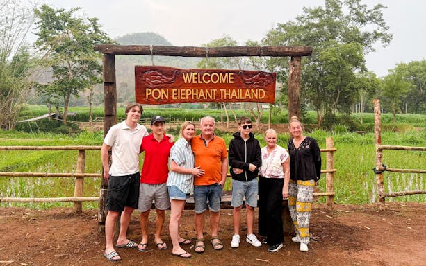 Group at entrance of Pon Elephant Thailand, Chiang Mai sanctuary.