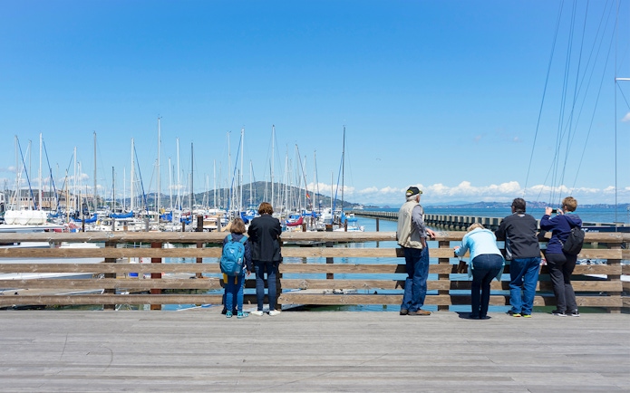 Guests viewing yachts at Pier 39 Marina, San Francisco, CA.