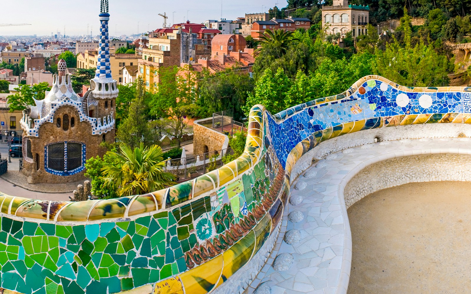 Serpentine Bench at Parc Guell, Barcelona, showcasing colorful mosaic tiles.