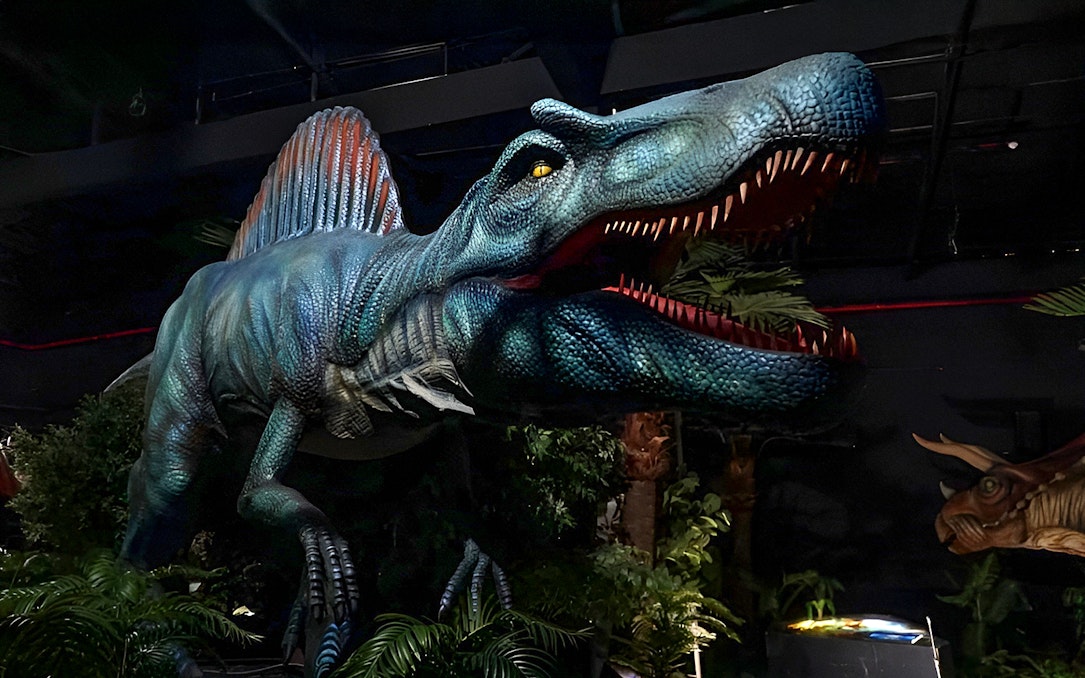 Dinosaur exhibit inside Dinosaur Encounter World, Perak, featuring a large animatronic dinosaur.