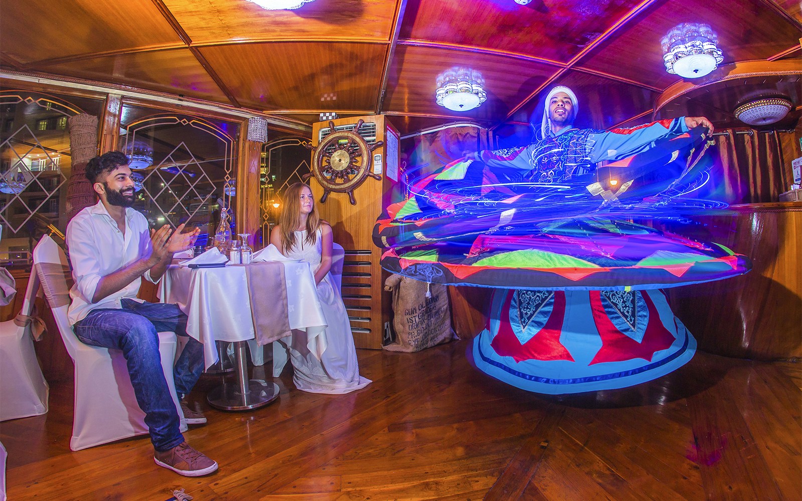 Alexandra Dhow Cruise with dinner and live entertainment at Dubai Marina, showcasing city skyline views.