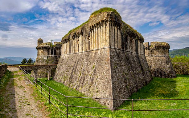 Fortezza di Sarzanello, medieval fortress with stone walls and towers, Sarzana, Italy.