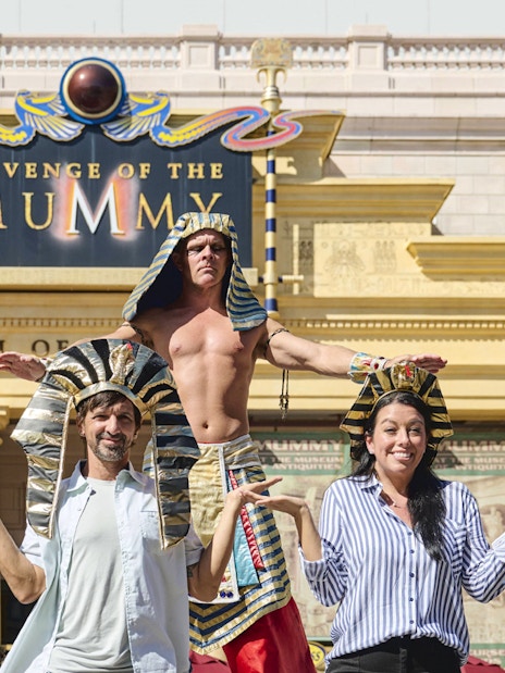 Guests posing with staff in Egyptian costumes at Revenge of the Mummy, Universal Studios Orlando.