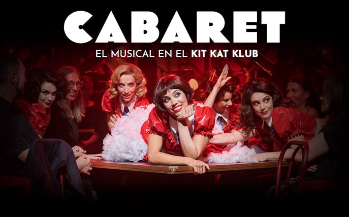 Performers in red costumes at Cabaret Madrid show, Kit Kat Klub setting.