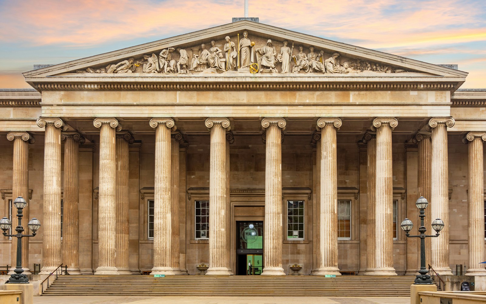 British Museum main entrance with visitors entering, London, UK.