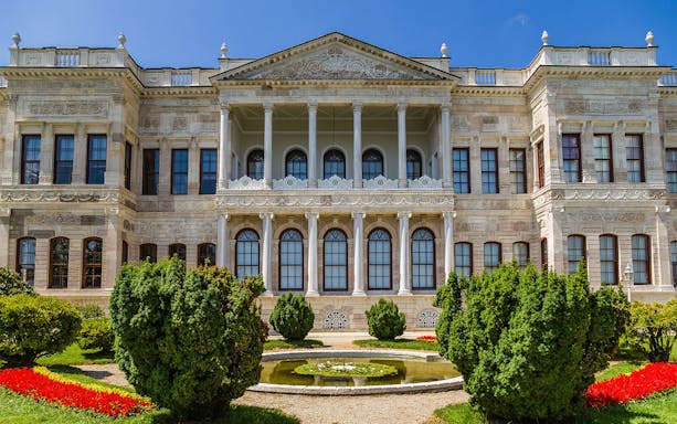 Dolmabahce Palace facade with garden and fountain, Istanbul tour.