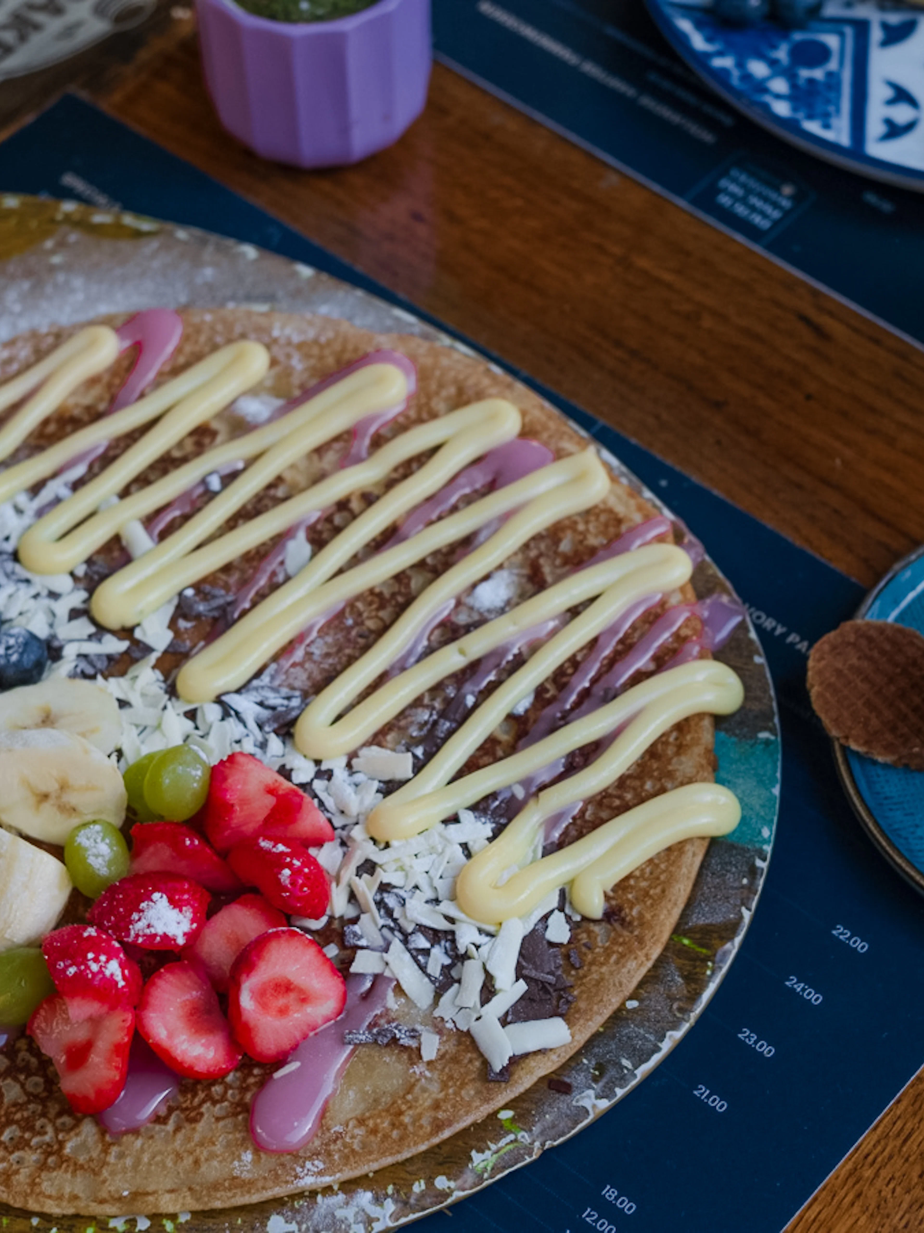 Dutch pancake with fruit and cream, served with coffee and juice, part of Rembrandt tour brunch in Amsterdam.
