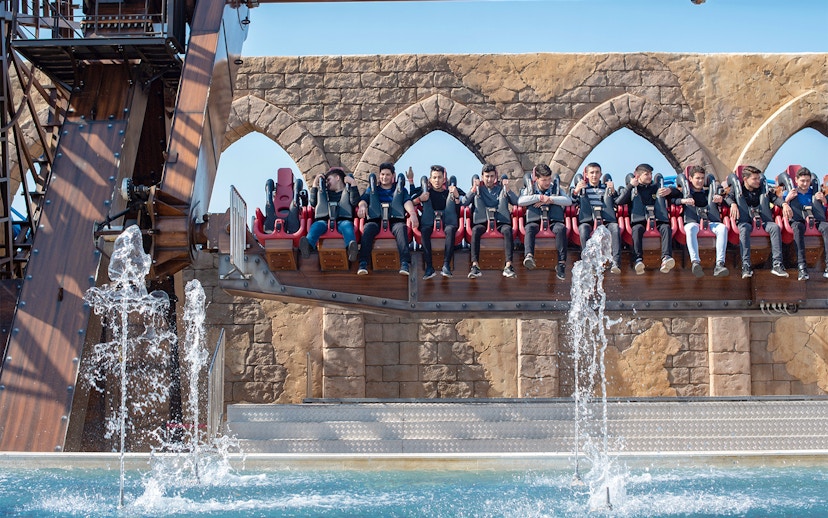 Visitors on a water ride at The Land of Legends Theme Park.