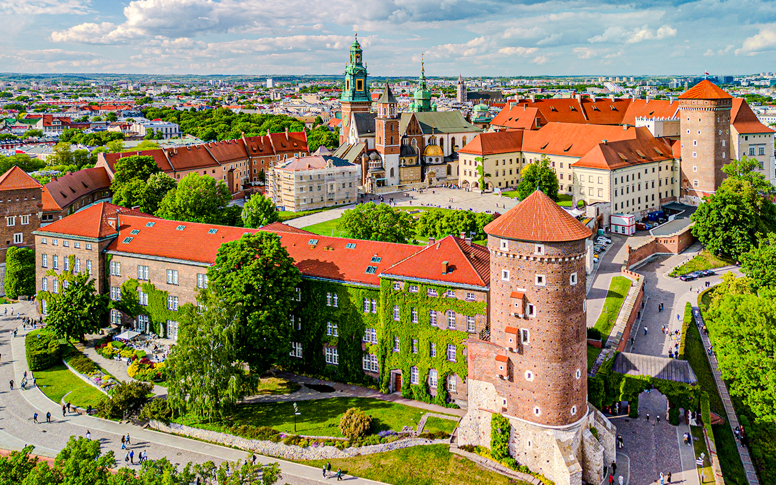 Aerial view of Wawel Royal Castle in Kraków, Poland, showcasing its historic architecture and surrounding greenery.