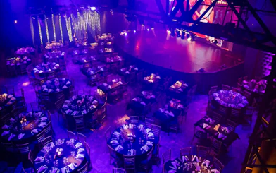 Dimly lit dining area set for Madero Tango Show in Buenos Aires.