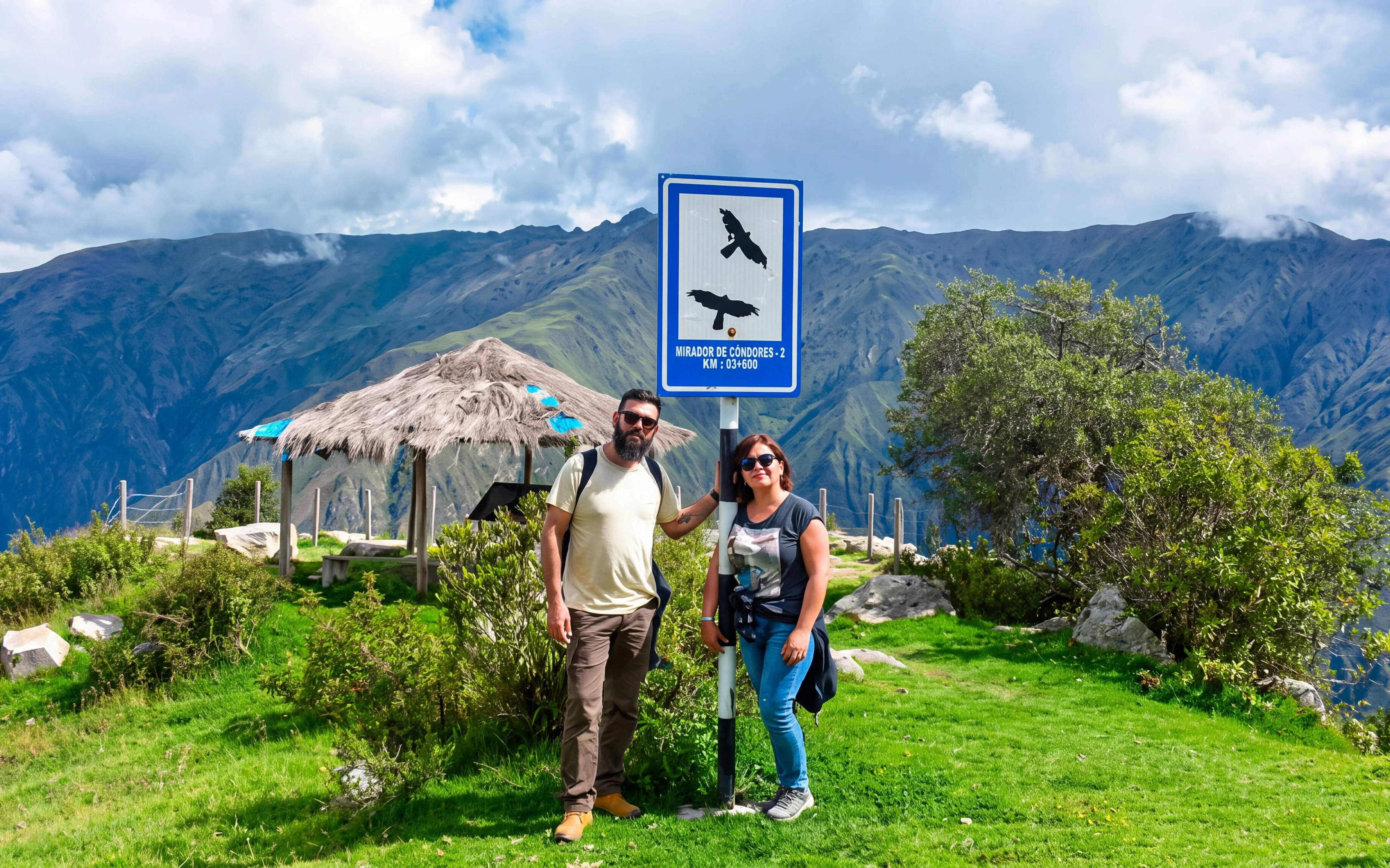 Chonta Condor Viewpoint sign with tourists, overlooking Apurímac River canyon near Cusco, Peru.