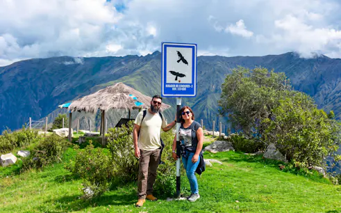 Chonta Condor Viewpoint sign with tourists, overlooking Apurímac River canyon near Cusco, Peru.