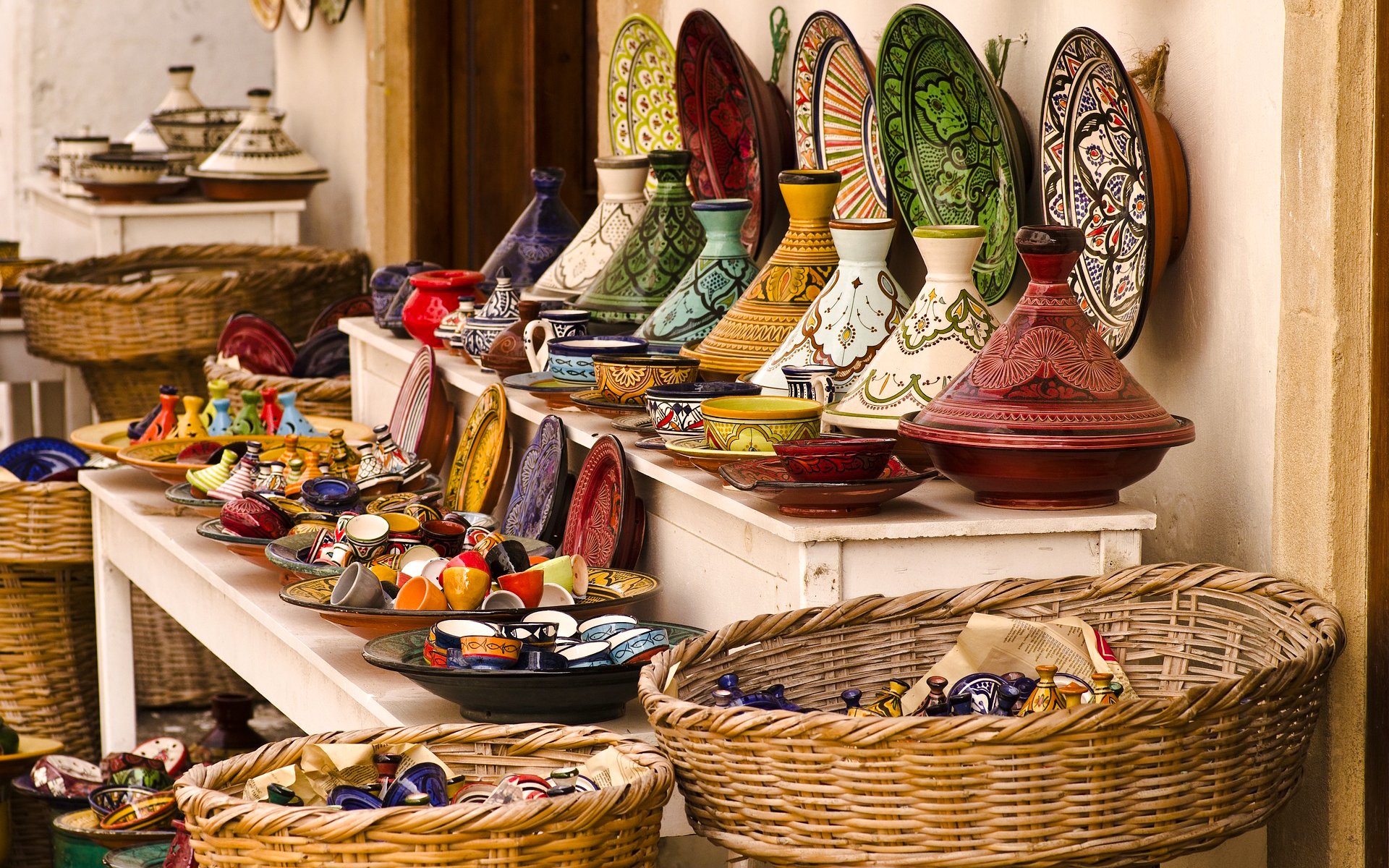 Colorful Moroccan pottery displayed at a souk in Marrakech.