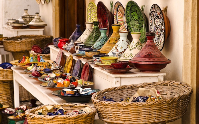 Colorful Moroccan pottery displayed at a souk in Marrakech.