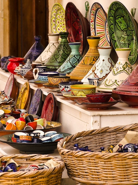 Colorful Moroccan pottery displayed at a souk in Marrakech.
