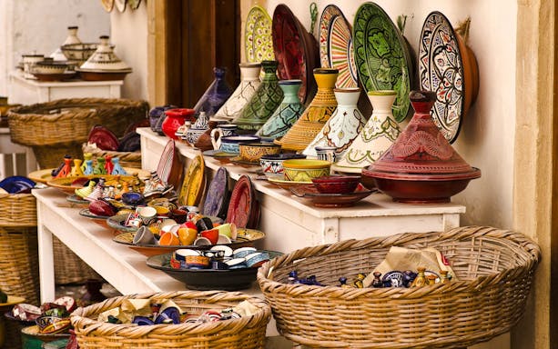 Colorful Moroccan pottery displayed at a souk in Marrakech.